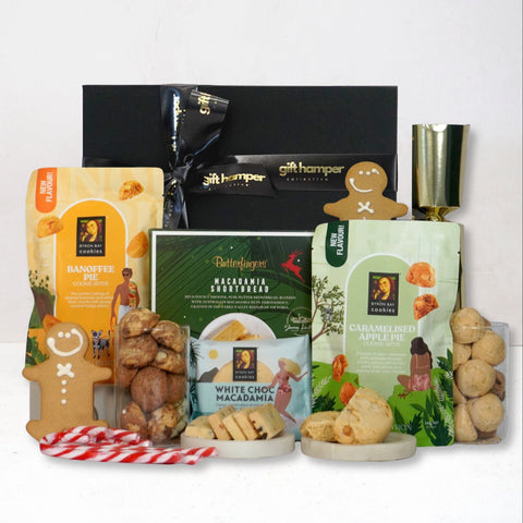 Gift hamper with assorted snacks and treats on a white background
